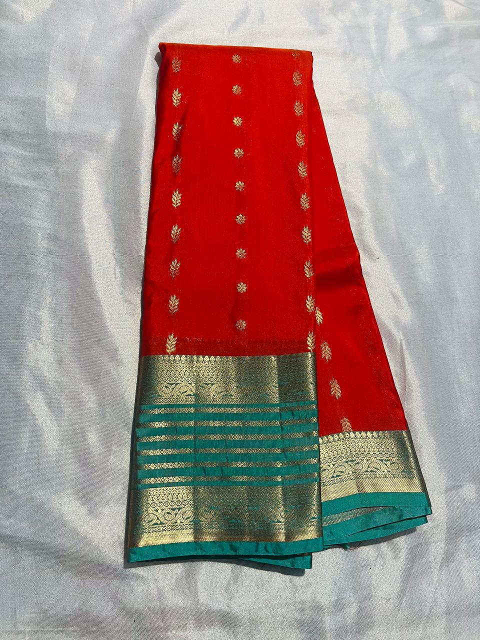 Elegant Red  Silk Saree with Teal Border & Golden Zari Work